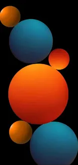 Vibrant spheres in orange and blue on a black background mobile wallpaper.