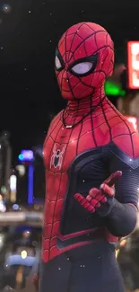 Spider-themed superhero in red costume against urban night backdrop.