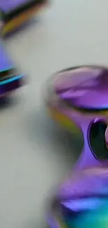 Close-up of colorful metallic spinner with vibrant purple and gold tones.