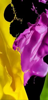 Vibrant splashes of yellow, pink, and green on a black background.