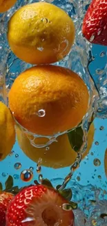 Citrus and strawberries splashing in water with a blue background.
