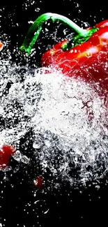 Red pepper splashes through water on black background.