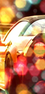 Vibrant orange sports car with bokeh effect on a colorful background.