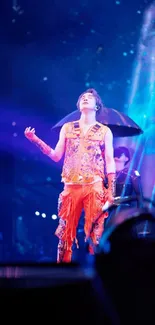 Colorful stage performance with vibrant lighting and artist in orange attire.