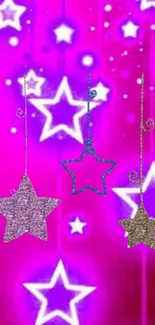 Vibrant wallpaper with glowing stars on pink.