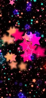 Vibrant starry night wallpaper with colorful stars in pink, blue, and orange hues.