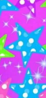 Colorful polka dot stars on pink wallpaper.