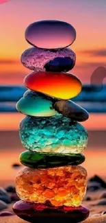 Colorful stacked stones at sunset on beach.