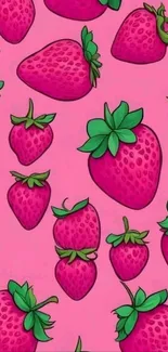 Bright pink wallpaper with green-topped strawberries in a playful design.