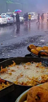 Fried snacks on rainy street with cars and umbrellas.