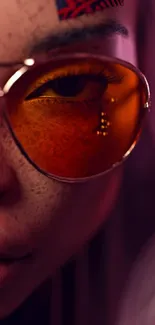 Close-up art with orange sunglasses and vibrant colors.