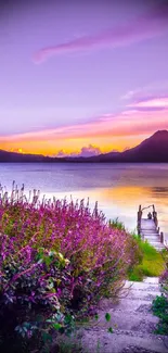 Vibrant purple sunset over a tranquil mountain lake landscape.