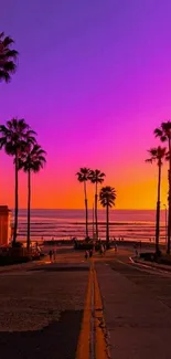 Vibrant purple sunset with palm trees and beach view.