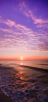 Beautiful sunset over ocean with purple and orange sky.