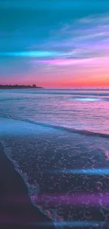 Vibrant sunset beach with blue and pink hues.