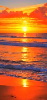 Breathtaking sunset on a serene beach with orange skies and gentle ocean waves.