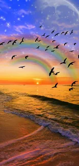 Vibrant sunset beach wallpaper with rainbow and flying birds.