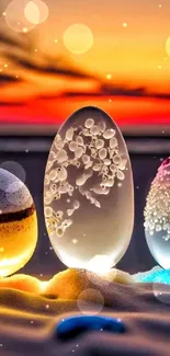 Glowing glass eggs on sand with vibrant sunset