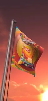 Colorful flag with Skittles design against a sunset sky.