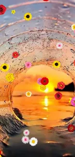 Sunset through a water tube with colorful flowers on a beach.