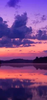 A vibrant sunset over a serene lake, with purple and pink cloudy sky reflections.