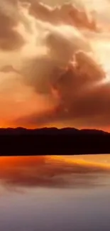 Vibrant sunset view over a tranquil lake with mountain reflections.