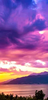 Vibrant purple sunset landscape over mountains with colorful sky.