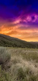 Vibrant sunset over a mountain landscape with colorful sky.