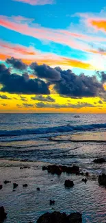 Vibrant sunset over ocean with colorful sky.