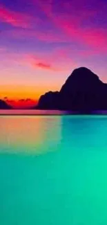 Vibrant ocean sunset with teal waters and colorful sky.