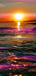 Vibrant sunset over ocean with colorful reflections and serene view.