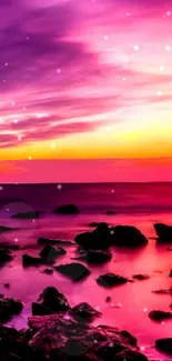 Vibrant sunset over ocean with rocks and vivid colors.