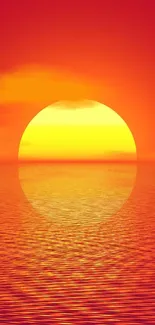 Vibrant sunset over a calm ocean with red and yellow hues.