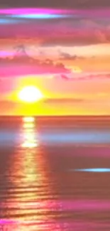 Vibrant sunset over calm ocean with pink and purple hues.