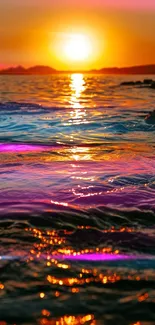 Vibrant sunset over ocean with colorful reflections.