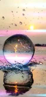 Reflective sphere on water with colorful sunset background, creating a serene wallpaper.