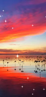 Vibrant sunset reflecting on a calm lake with red and blue hues.