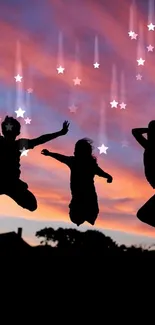 Silhouette of people jumping with a vibrant sunset sky in the background.