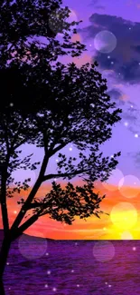 Tree silhouette against vibrant sunset sky wallpaper.