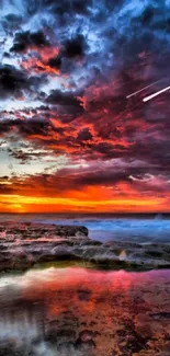 Vibrant sunset over ocean with colorful sky and clouds.