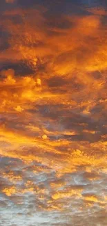 Sunset sky with vibrant orange clouds creating a warm and serene atmosphere.