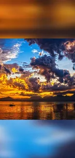 Vibrant sunset with orange clouds over a serene lake.