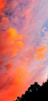 Vibrant orange and purple sunset sky with clouds.