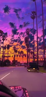 Sunset street with palm trees and vibrant sky on phone wallpaper.