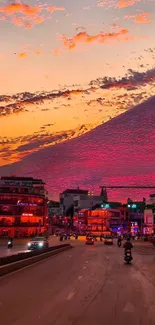 City street at sunset with vibrant sky and bustling life.