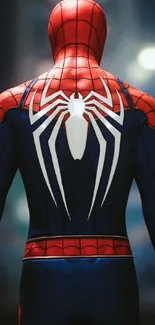 Back view of a superhero in a red and blue costume with spider emblem.