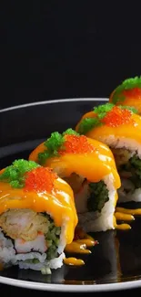 Colorful sushi rolls with orange sauce and toppings on a dark plate.