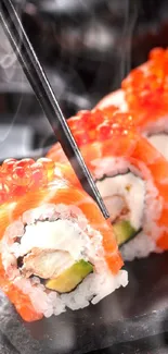 Sushi roll with salmon and roe on a slate plate.