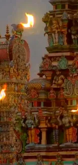 Intricate Indian temple architecture with vibrant colors and fire elements.