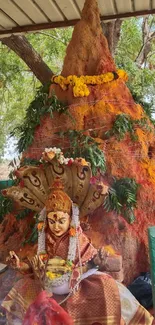 Vibrant temple shrine with deity statue and decorations.